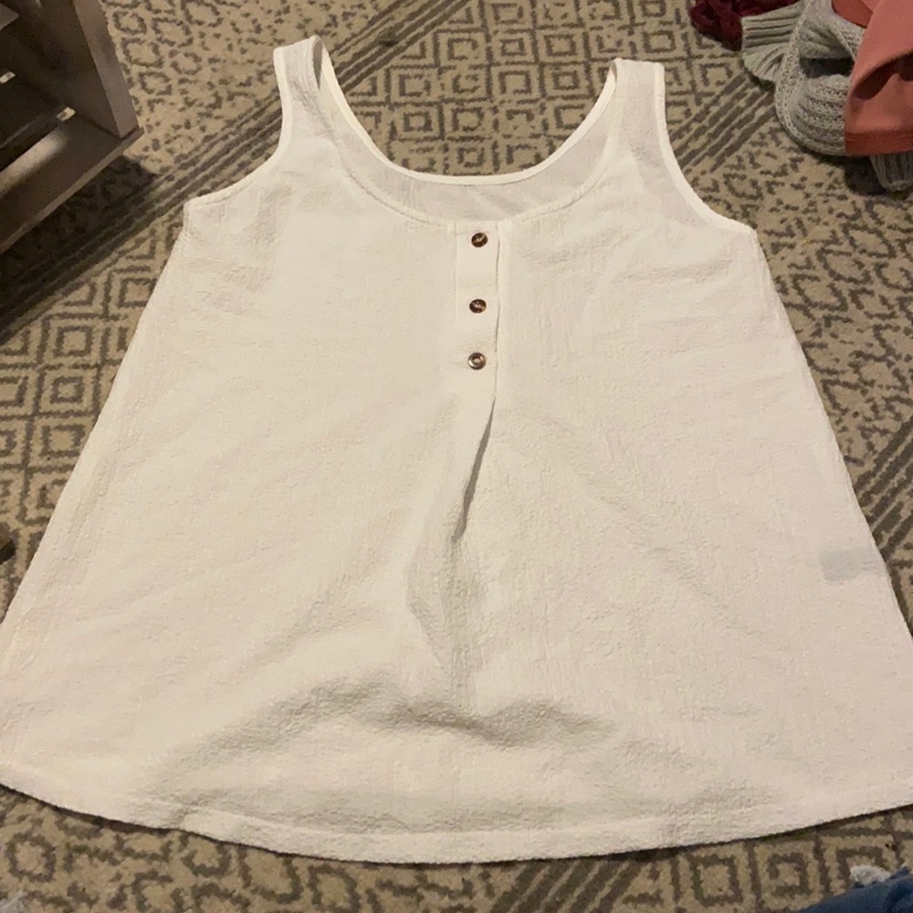 a white buttoned up tank top !